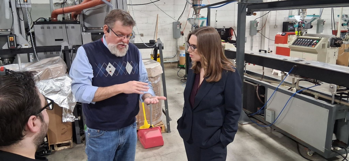 Rep. McBride speaks with a manufacturer at Printed Solid.
