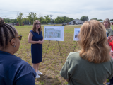 Rep. McBride stands near renderings of the new sewer lift station