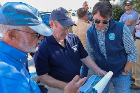 Senator Coons looks at a rendering